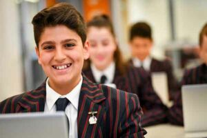 Three-secondary-students-wellbeing on a laptop
